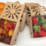 Organic strawberries and cherry tomatoes in recyclable half pint container