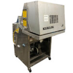 Kliklok Jr Folding Machine with hood down.