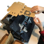 Folding Robot for produce containers fits on a table top.
