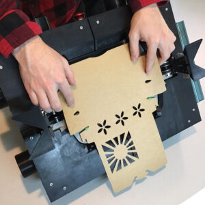Hands placing container folding robot.